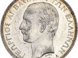 Gros plan sur une pièce de monnaie portant le visage d'un homme