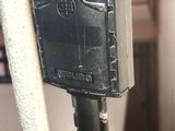 a close up of a black electrical device on a stand