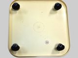 a close up of a metal tray with black knobs on it