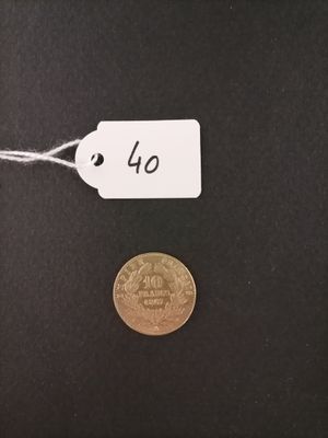 a close up of a coin with a price tag attached to it