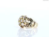 an image of a gold and diamond ring on a white surface