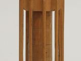 a small wooden structure with a bird on top