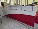 a red and white bench in the middle of a room