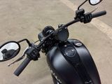 a black motorcycle parked on the side of the road