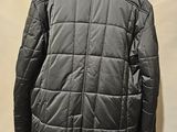 the back of a man ' s jacket on a mannequin mannequin mannequin mannequin mannequin mannequin mannequin mann