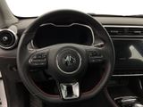 the interior of a car with a steering wheel and dashboard controls
