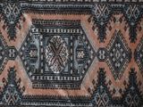 a close up of a rug with a pattern on it