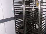 an image of a rack with trays of food on it
