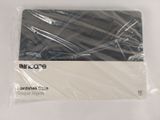 packaging of a computer mouse pad in a plastic bag on a white surface