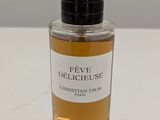 a close up of a bottle of perfume on a table