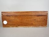 an old wooden box sitting on top of a table