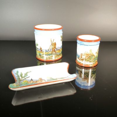 three cups and a tray sitting on a table
