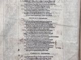 an old book with writing on it sitting on top of a table