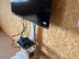 a flat screen tv mounted on a wall in a room