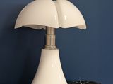 a lamp that is sitting on top of a wooden table