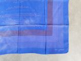 a blue handkerchief with a blue and orange design on it