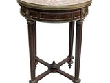 une image représentant une table ronde avec un plateau en marbre et des pieds en bois
