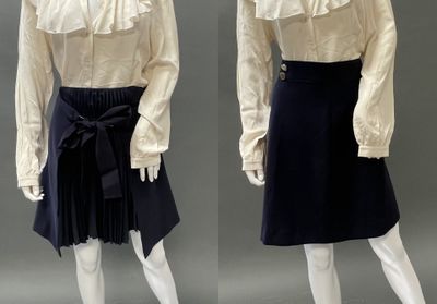 two mannequins dressed in white shirts and black skirts