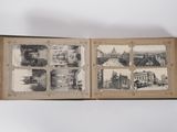 an open book with pictures of a city in it