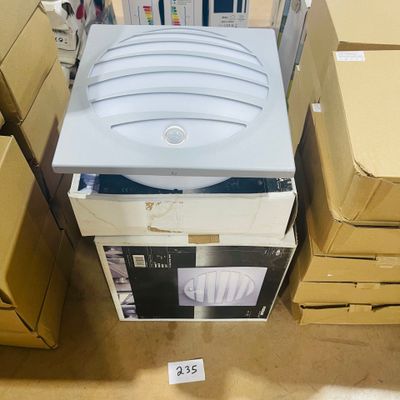 a stack of boxes with a computer on top of it