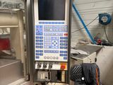 a machine that is sitting in a room with a chair