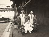 a group of people that are standing outside of a building