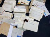 a pile of letters and envelopes on a table