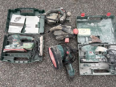 many tools that are laying out on the ground