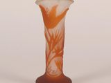 a glass vase that has a flower design on it