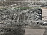 many rolls of wire wrapped in plastic on a table