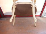 a chair that is sitting in front of a glass door