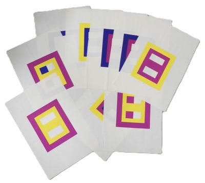 several pieces of paper with different colored squares on them