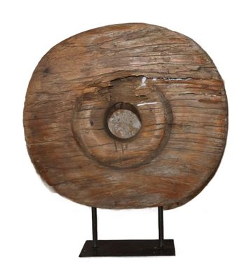 an image of a wooden sculpture of a spiral on a stand