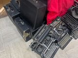 a pile of old typewriters and other items on the floor