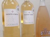 three bottles of wine sitting next to each other on a table