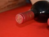 a bottle of wine that is sitting on a table