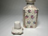 a vase and a salt shaker sitting on a table