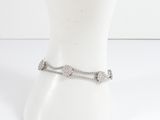 silver chain ankle bracelet with a heart charm on a mannequin head