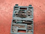 a tool kit that is sitting on the ground