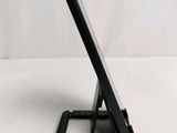 a cell phone that is sitting on top of a stand