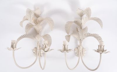 two wall sconces that are made out of white paper