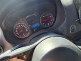 dashboard of a car with a steering wheel and gauges