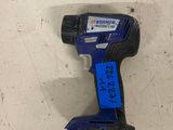 a blue cordless drill is laying on a white surface