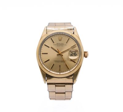 a close up of a watch on a white surface with a white background