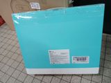 a close up of a blue box on a tiled floor