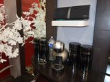 a table with a bunch of vases on it in a room