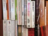a lot of books that are sitting on a shelf