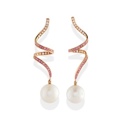 a pair of pearl and diamond earrings