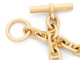 an image of a gold key chain with a cross on it