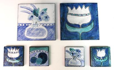 four pieces of artwork on the wall of a room